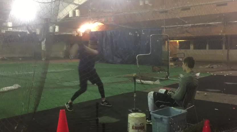 Front toss in an indoor cage