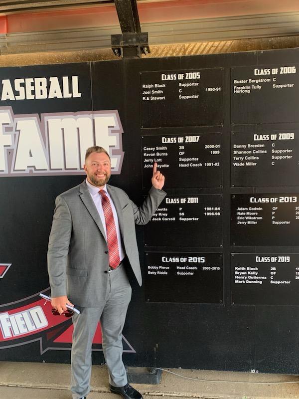 Wyatt Olsen pointing at the Class of 2007 plaque, Kevan Burns, OF, 1999